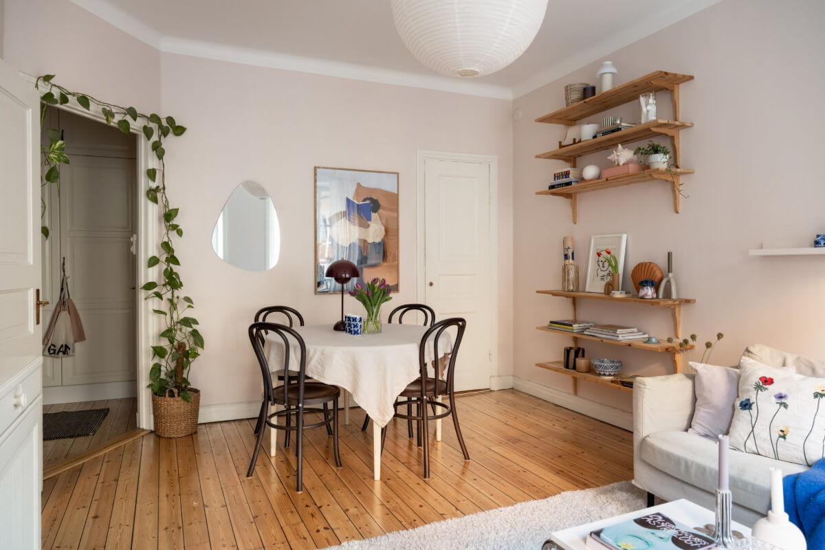 A Small Swedish Apartment with a Light Pink Living Room 7 light pink living room wooden floorboards