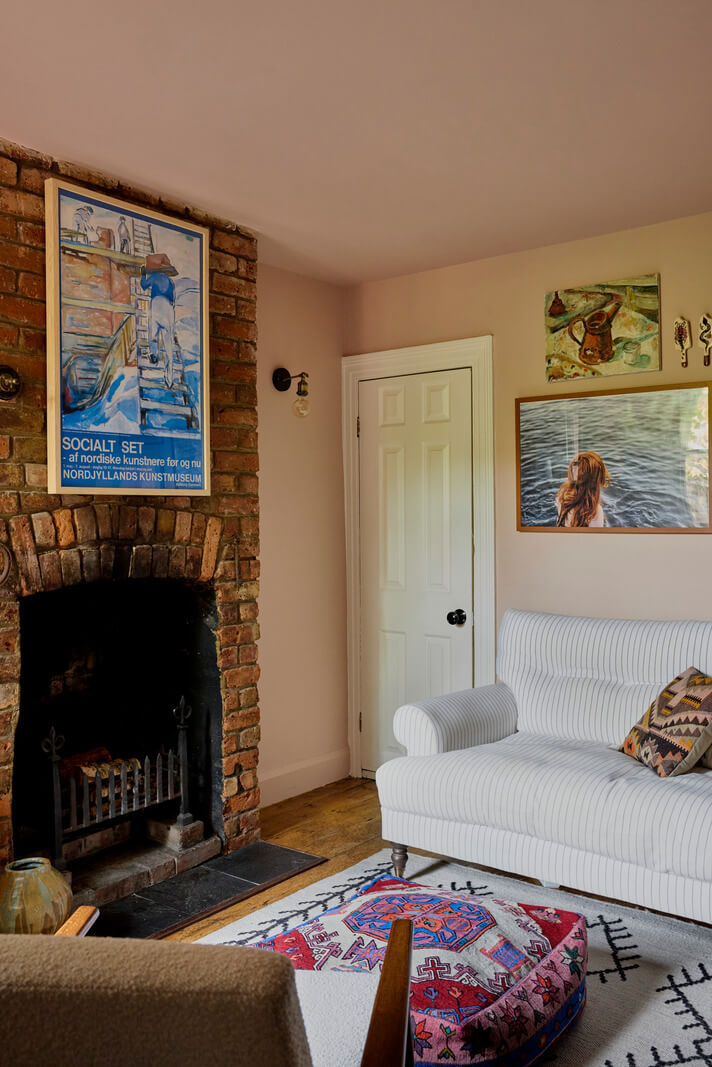 light pink sitting room brick fireplac