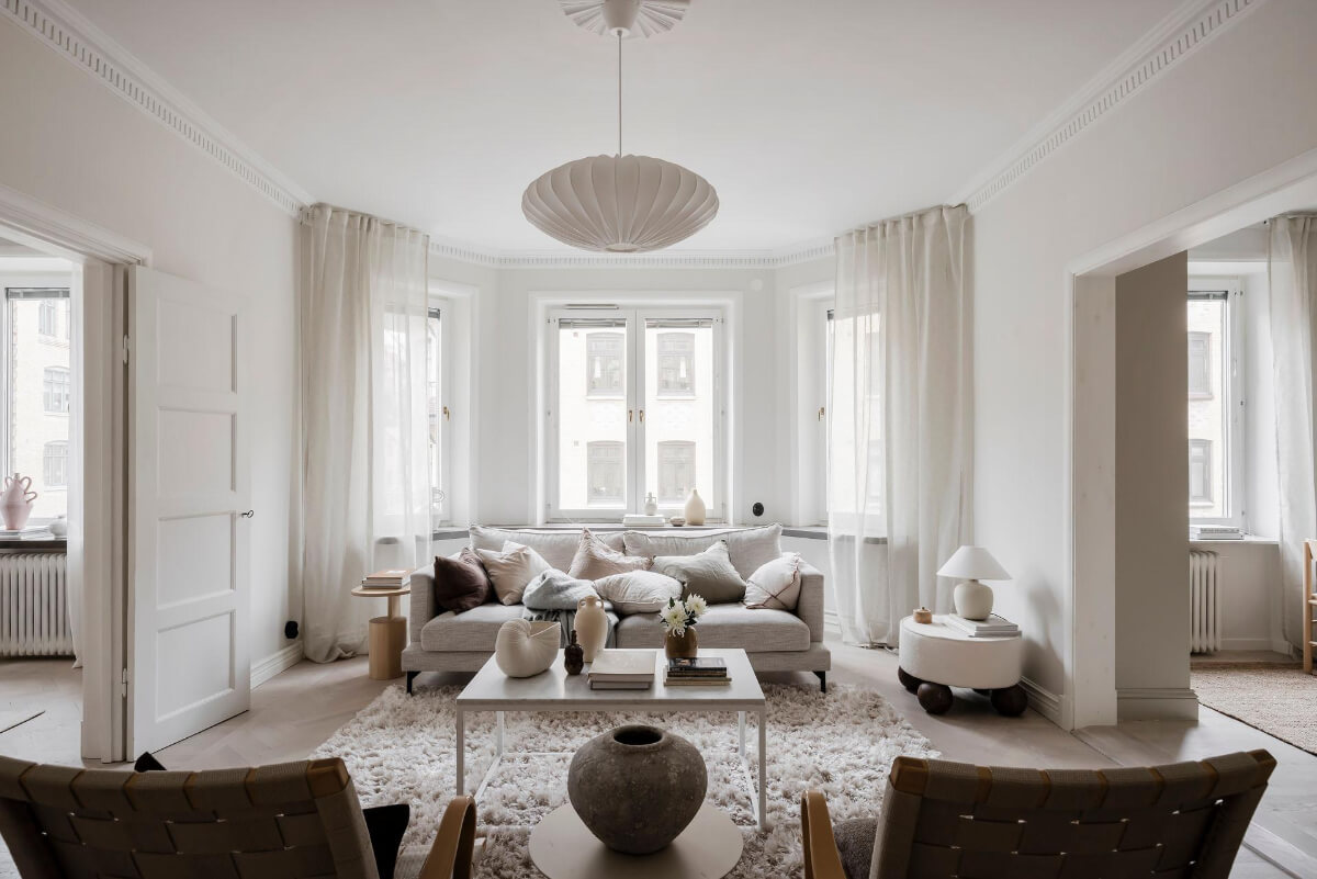 A Light Corner Apartment with an Open Flowing Floor Plan 14 light swedish living room bay window