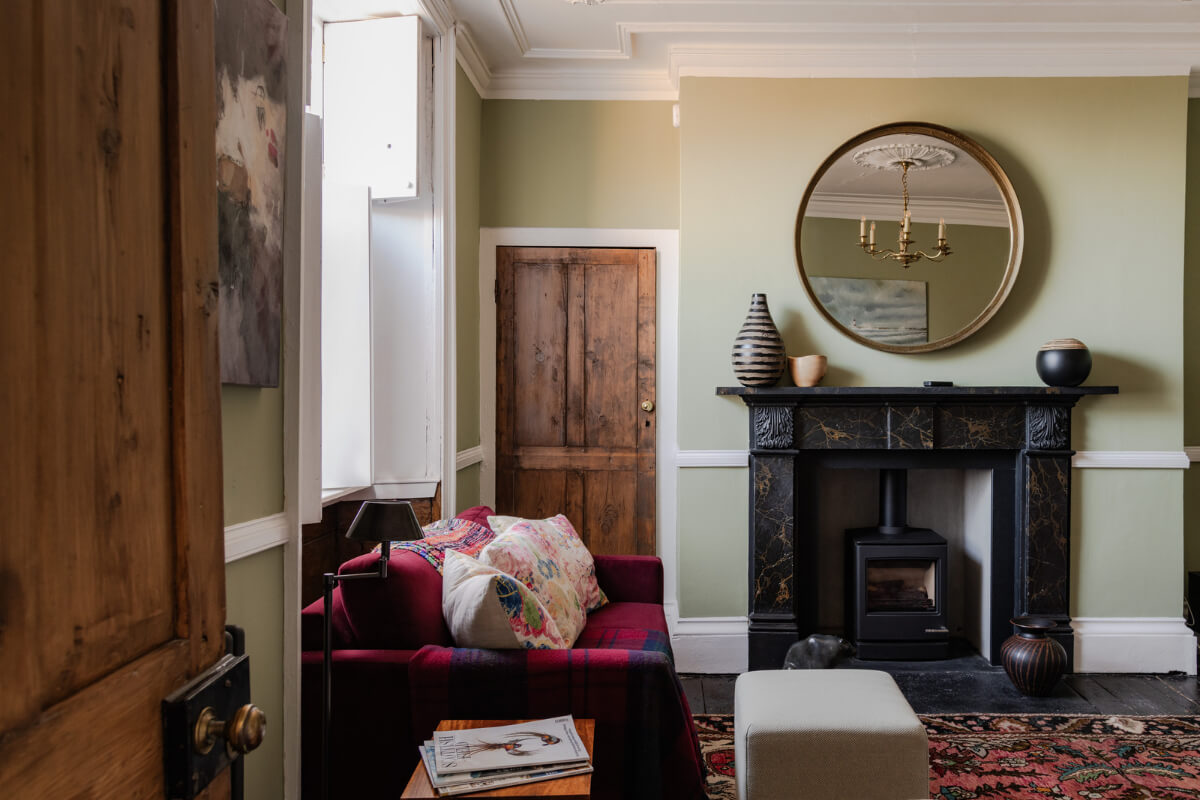 A Georgian English House Restored To Its Former Glory 13 living room black marble fireplace mantel