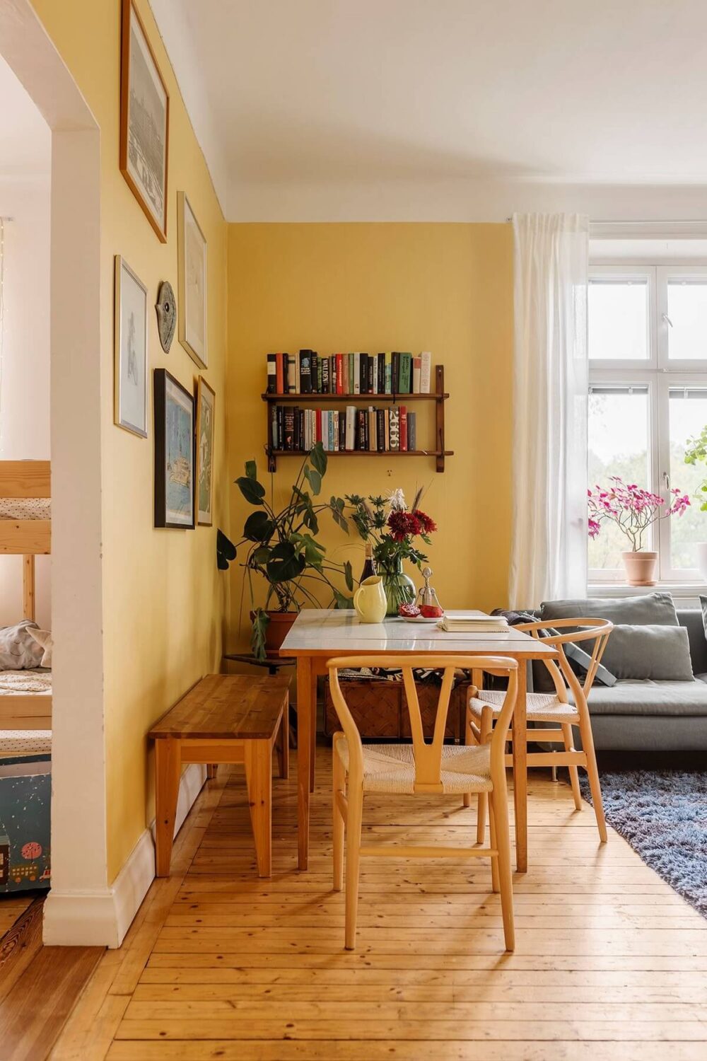 The Color Trends for 2025: Warm, Natural Shades and a Cheerful Accent 66 living room dining table wooden floor yellow walls nordroom