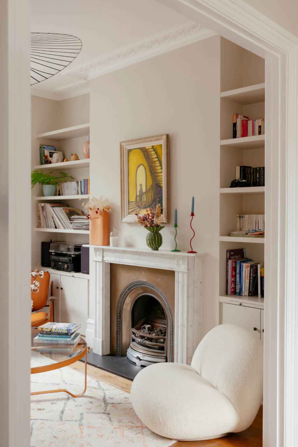 A Renovated Victorian Townhouse with a Small Split-Level Garden 2 living room fireplace bookshelves