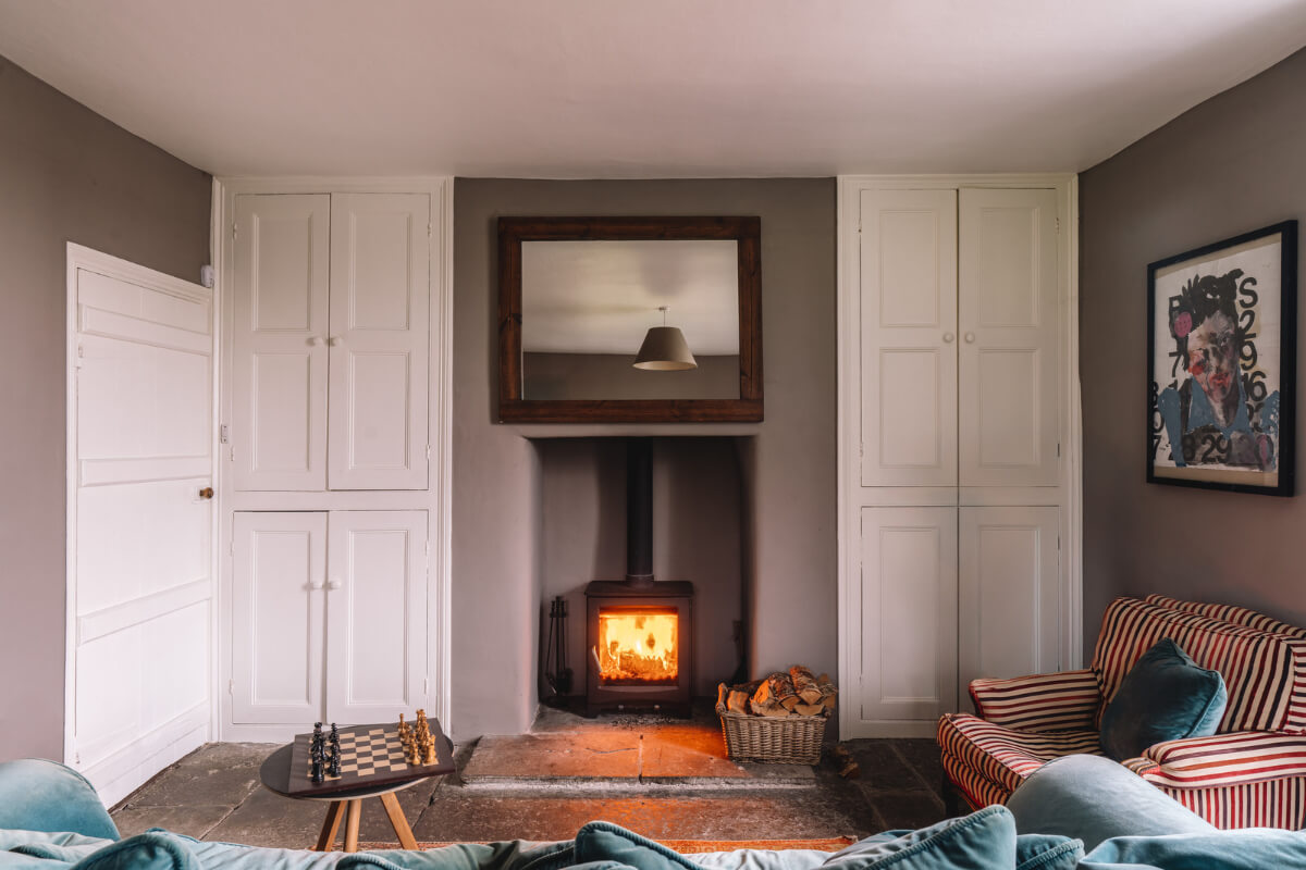 A Colorful 19th-Century Cottage in the Lake District 12 living room fireplace built-in cabinets