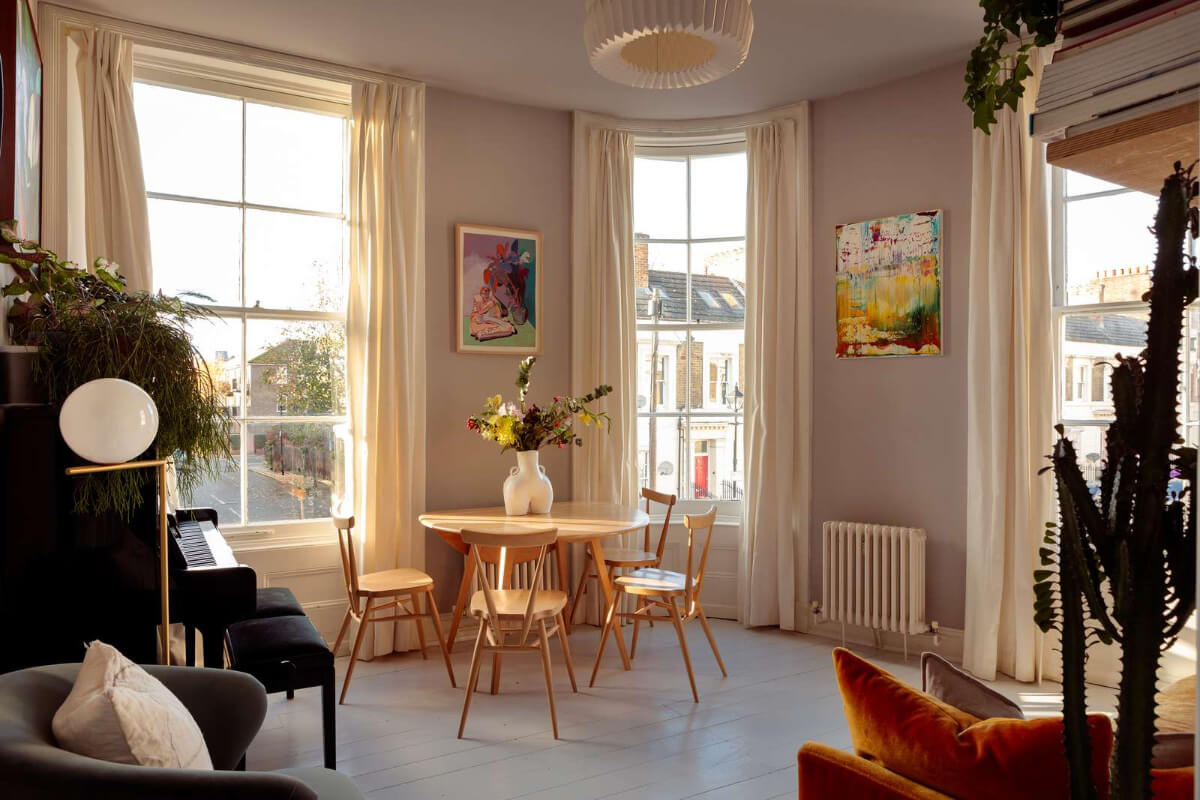 living room gray floorboards rounded wall with window
