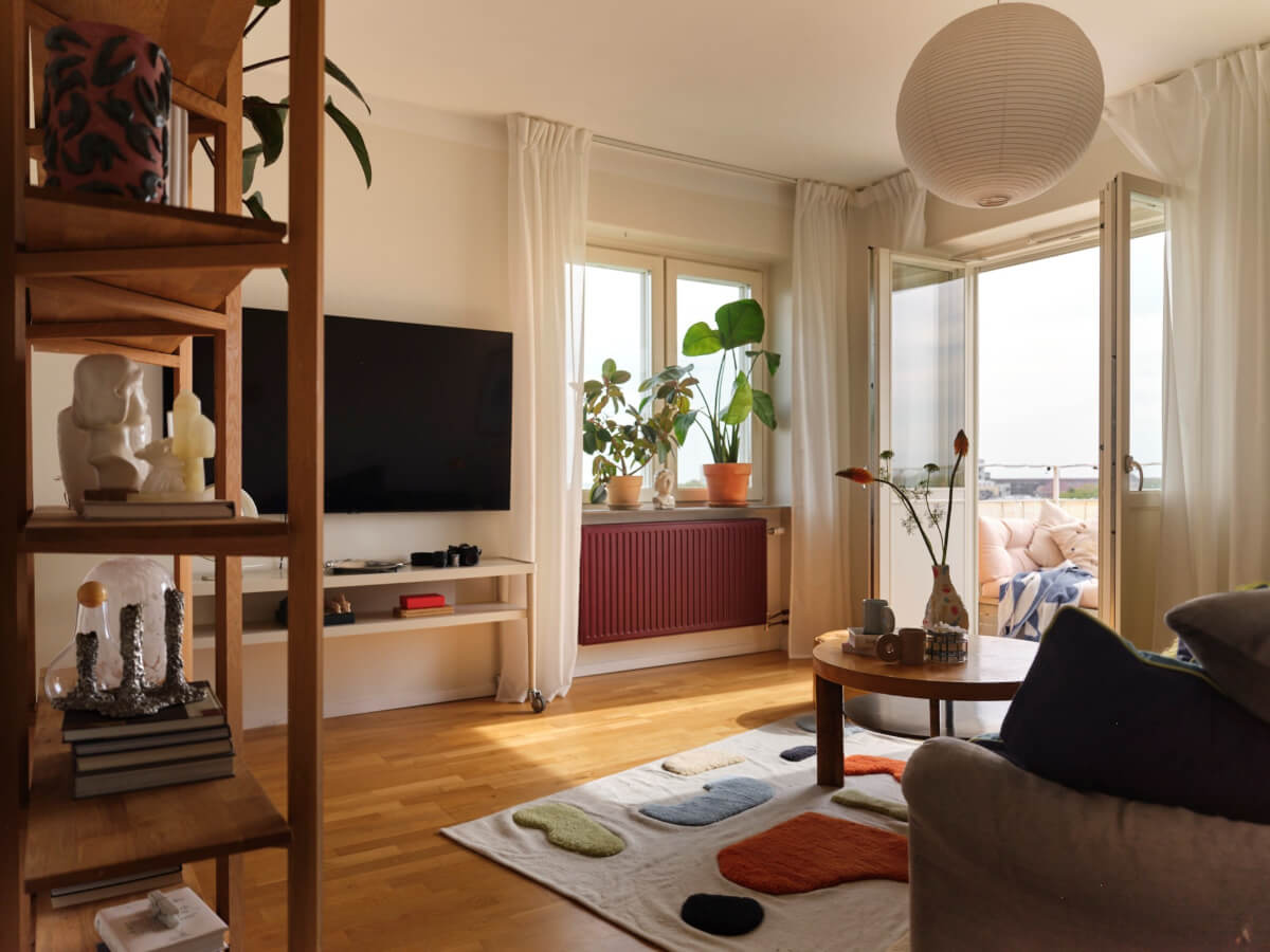 A 1940s Swedish Apartment with a Soft Yellow Kitchen 1 living room large glass doors