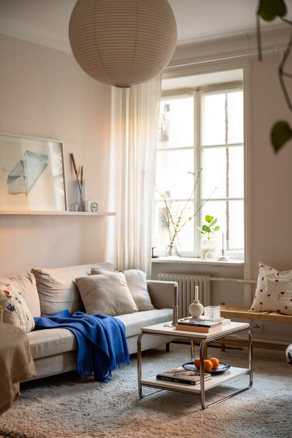 A Small Swedish Apartment with a Light Pink Living Room 4 living room light pink walls large window