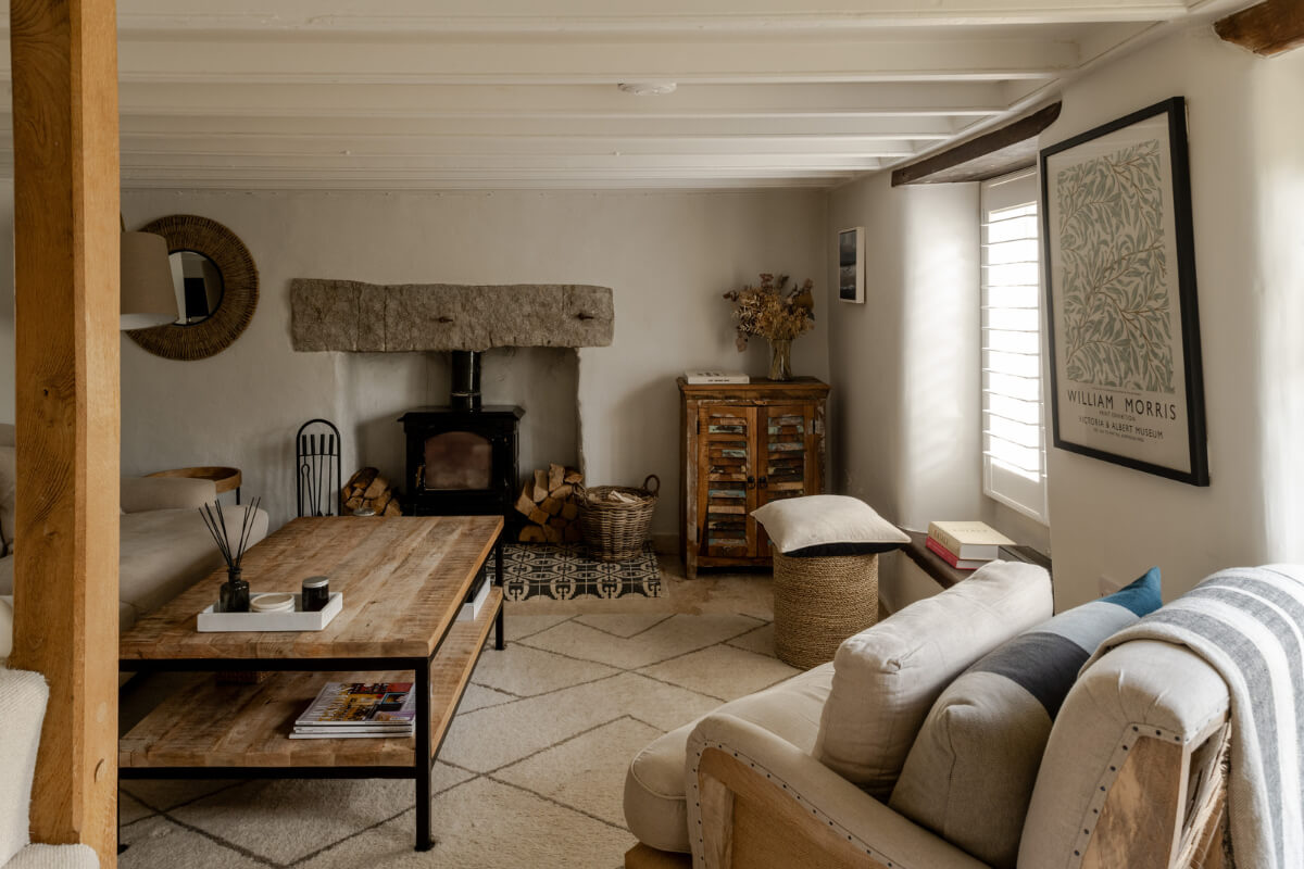 A Charming Stone Cottage with Period Features in Cornwall 1 living room low ceiling wood burner english cottage