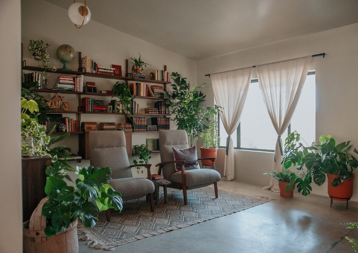 A Colorful Airbnb Home in the Morongo Valley 11 living-room-plants-bookshelves-nordroom