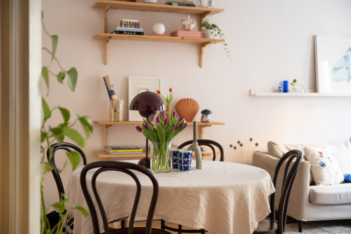 A Small Swedish Apartment with a Light Pink Living Room 8 living room round table