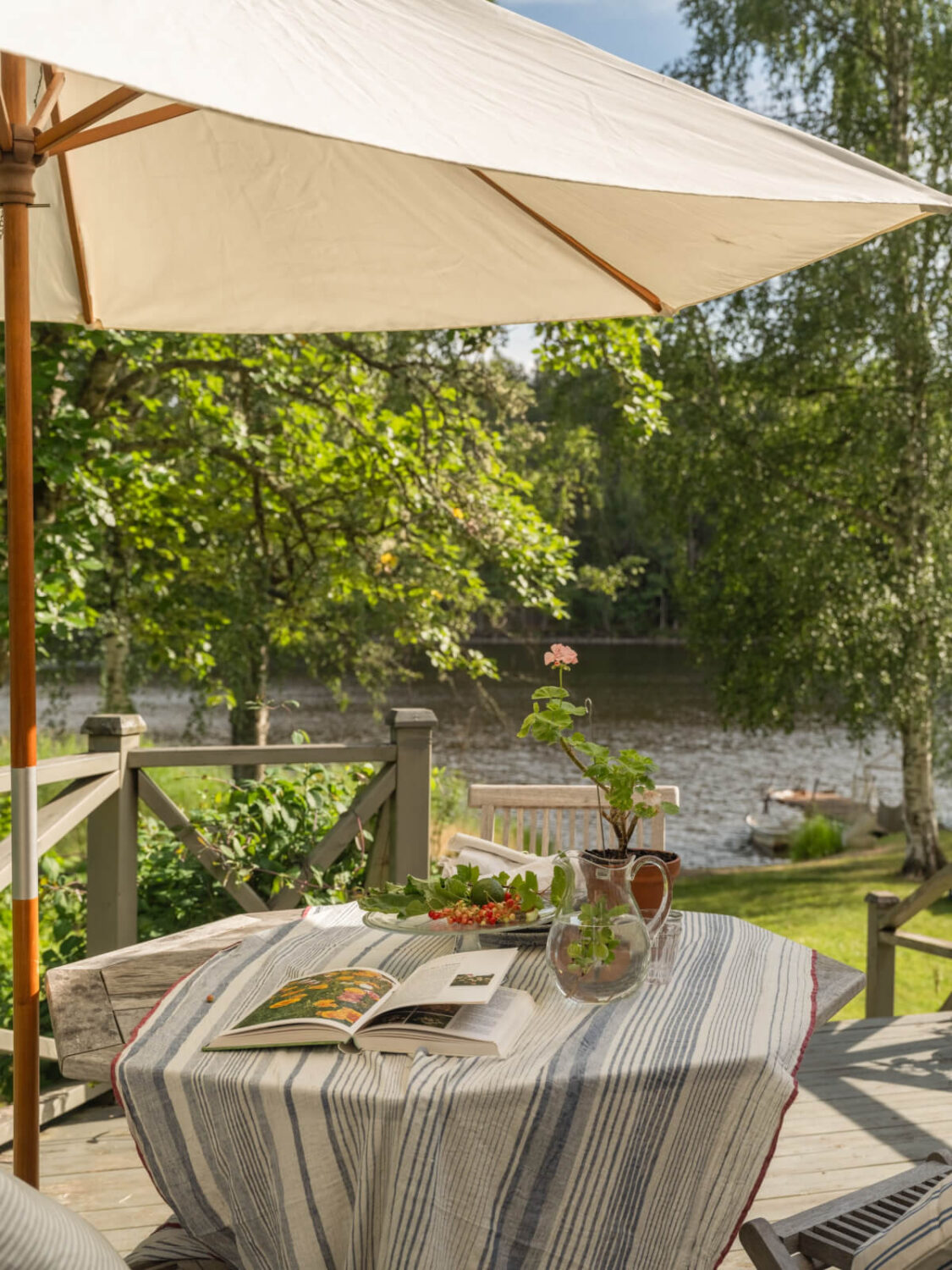 A 1930s Lakeside Country House with a Private Beach 23 living room terrace