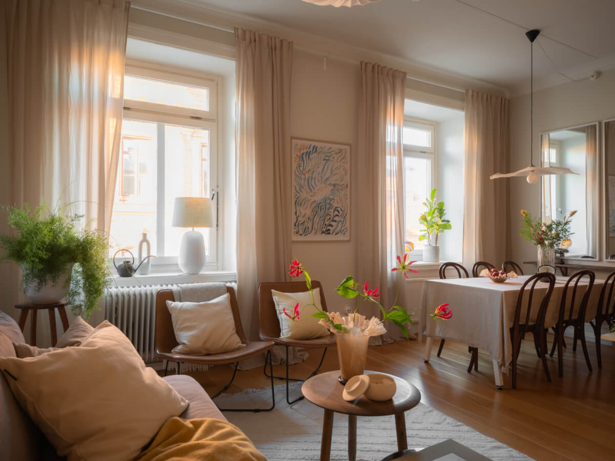 A 19th Century Apartment with a Dark Glass Room Divider 3 living room with dining table