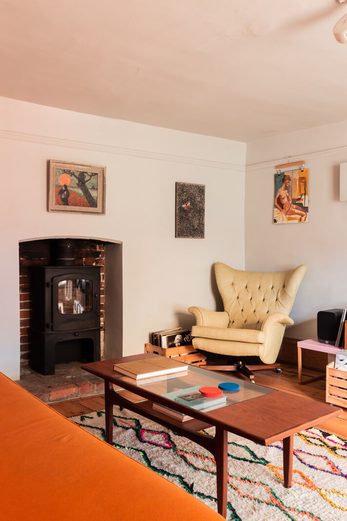 Rustic Wooden Elements in a Historic English House 7 living room woodburning stove colorful rug