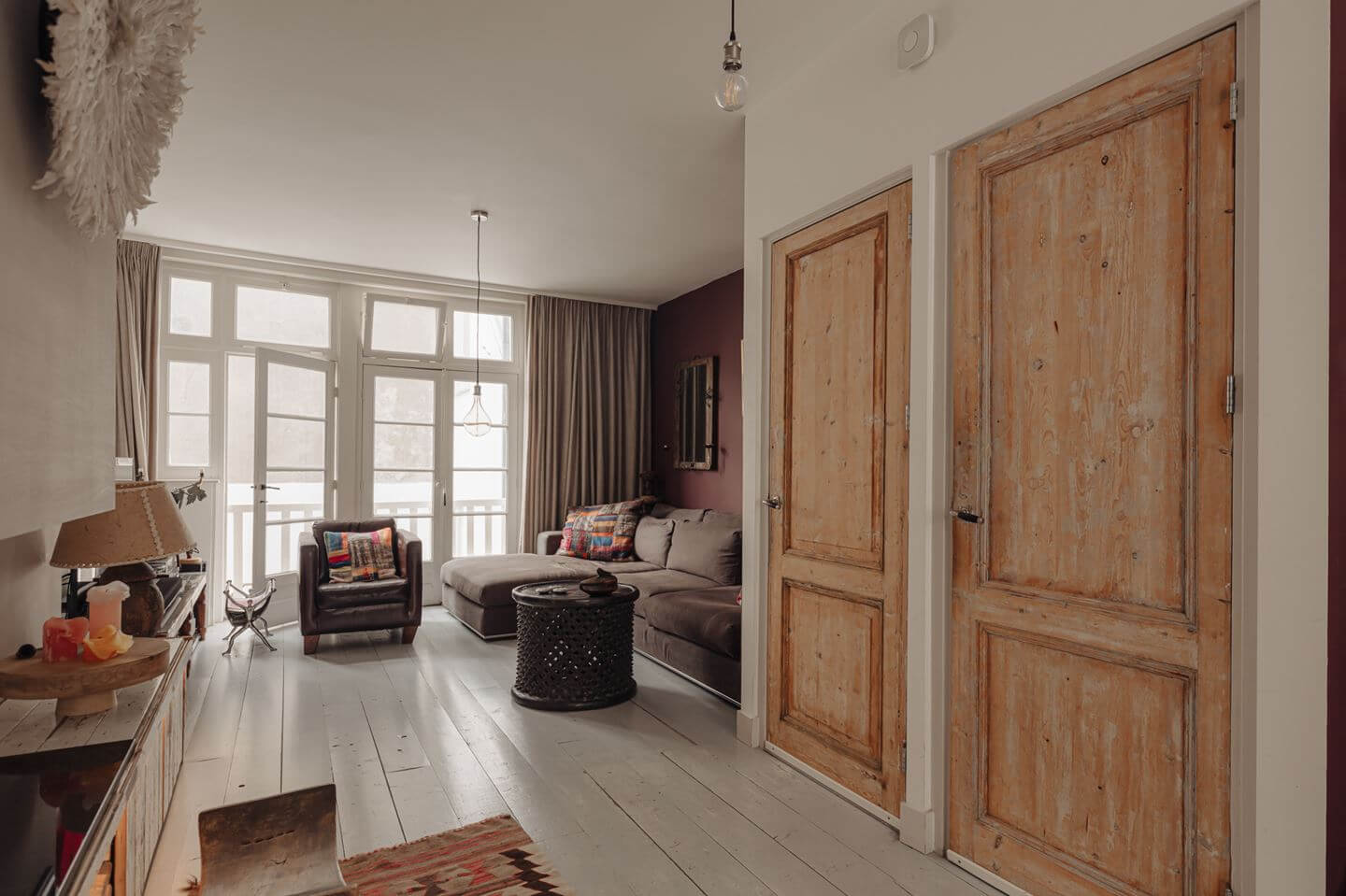 A Charming Amsterdam Townhouse with a Cozy Roof Terrace 8 living room wooden floorboards raw wooden doors