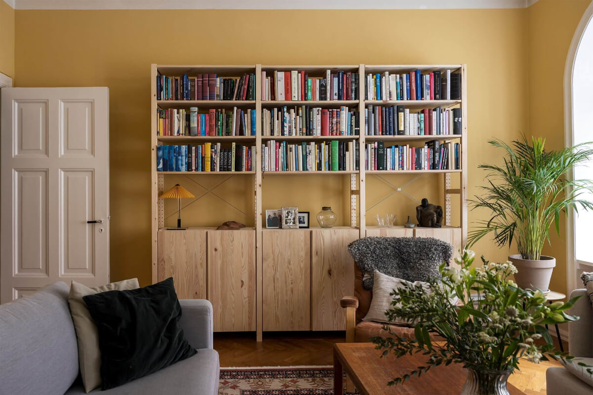 The Color Trends for 2025: Warm, Natural Shades and a Cheerful Accent 69 living room yellow walls ikea ivar cabinets with bookshelves and closed storage nordroom