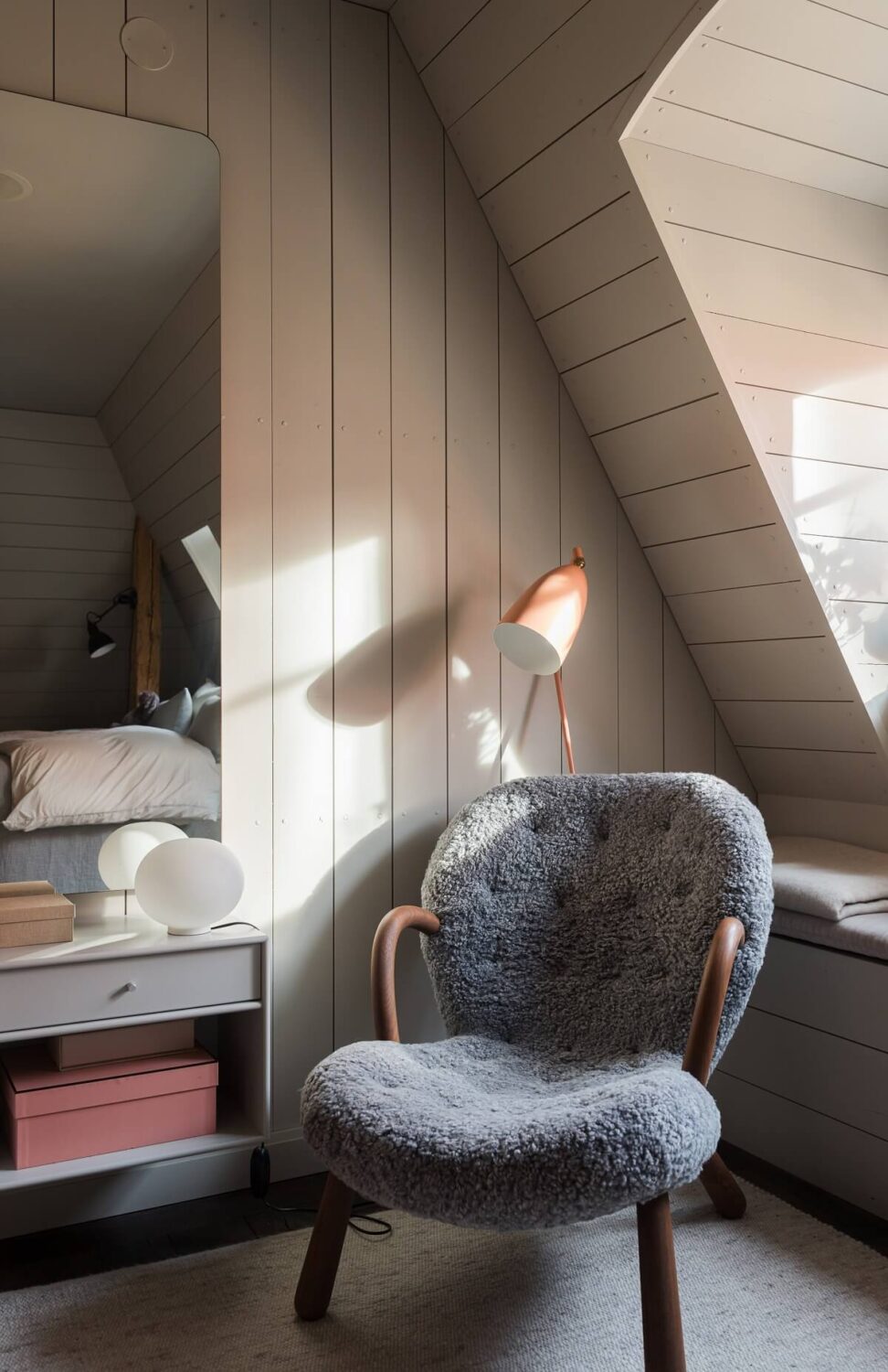 A Stylish Penthouse Apartment with Exposed Beams 25 lounge chair mirror bedroom