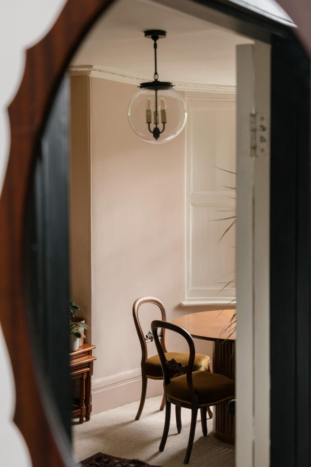 A Classic Georgian House in London with a Lush Garden 4 mirror view into dining room