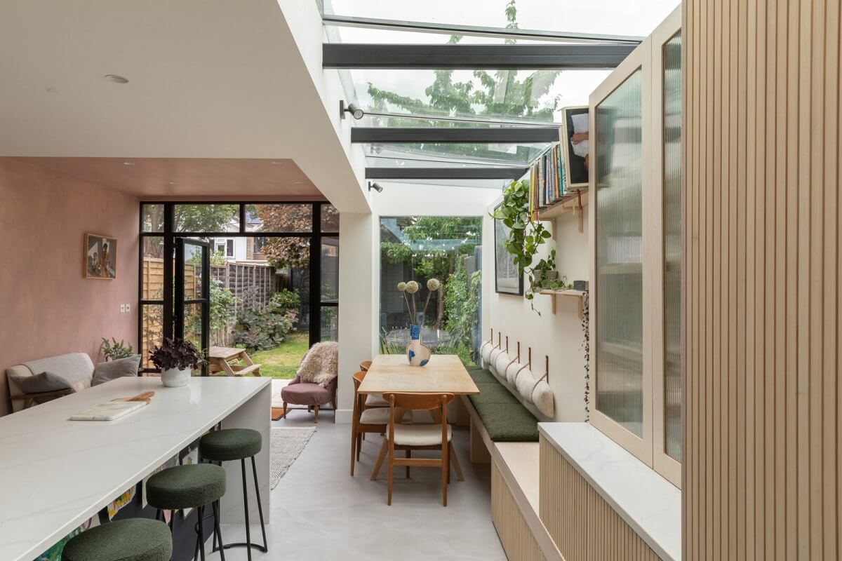 A London Family Home with a Light Modern Extension 1 modern kitchen extension skylight dining table bench seating nordroom