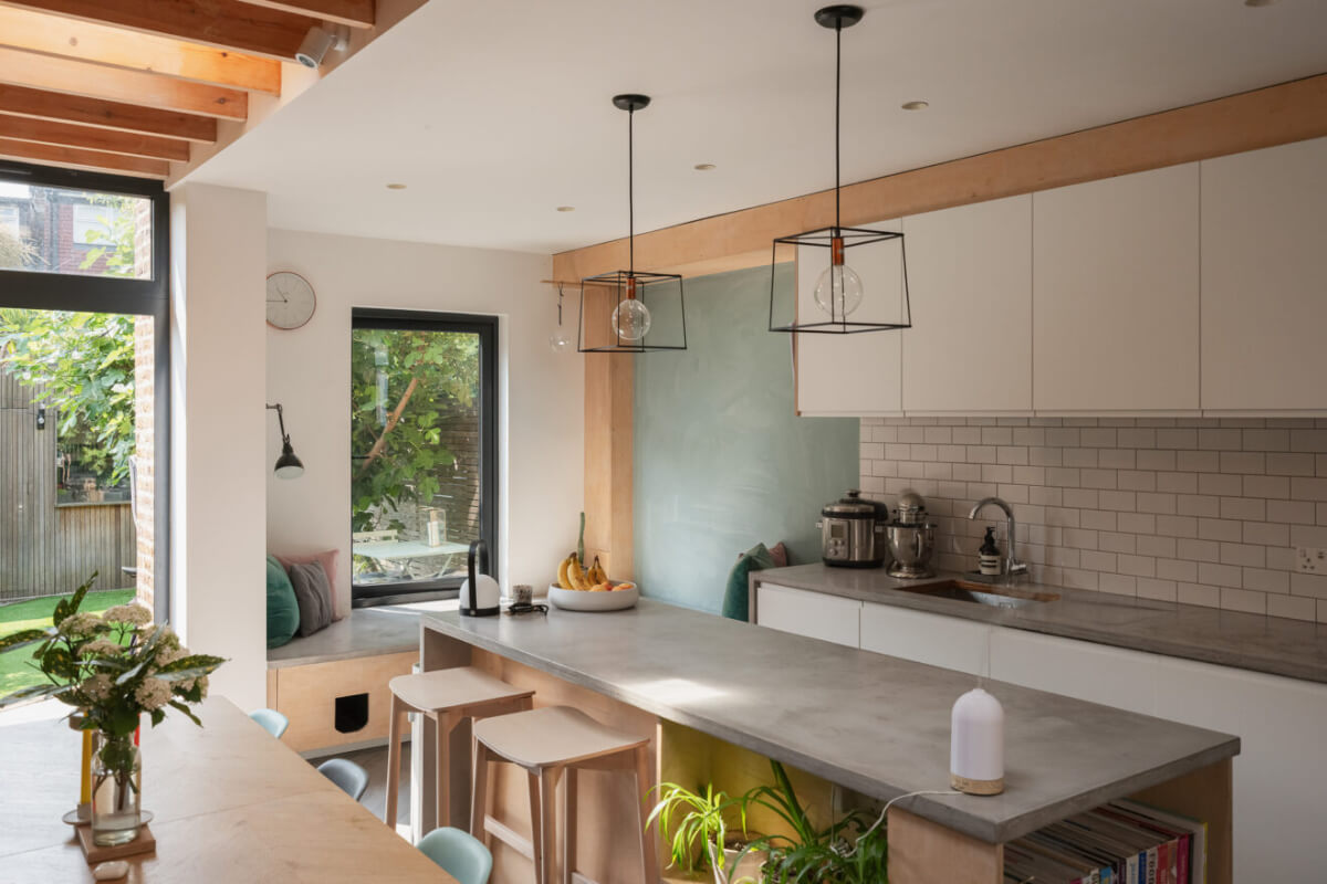 Exposed Brick and Wooden Beams in an Extended London Home 8 modern kitchen white cabinets concrete worktop kitchen island