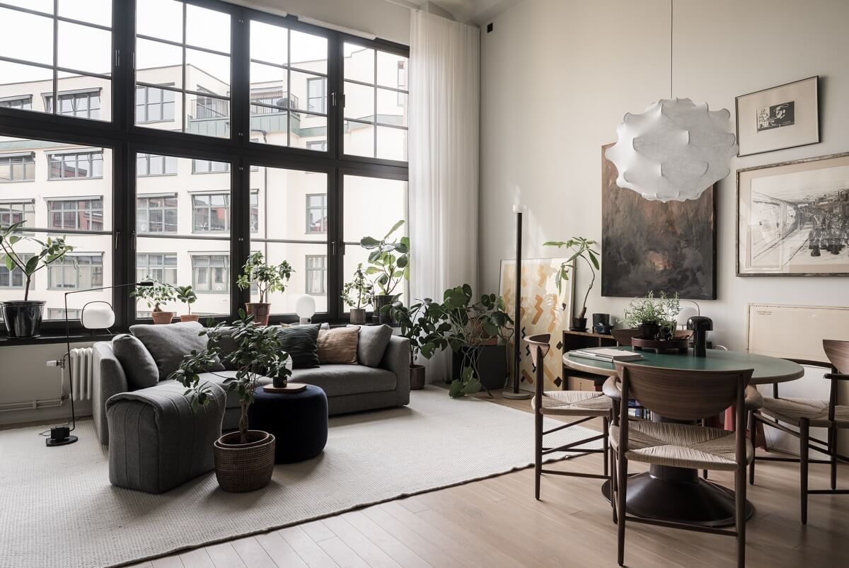 monochrome loft living space with large windows