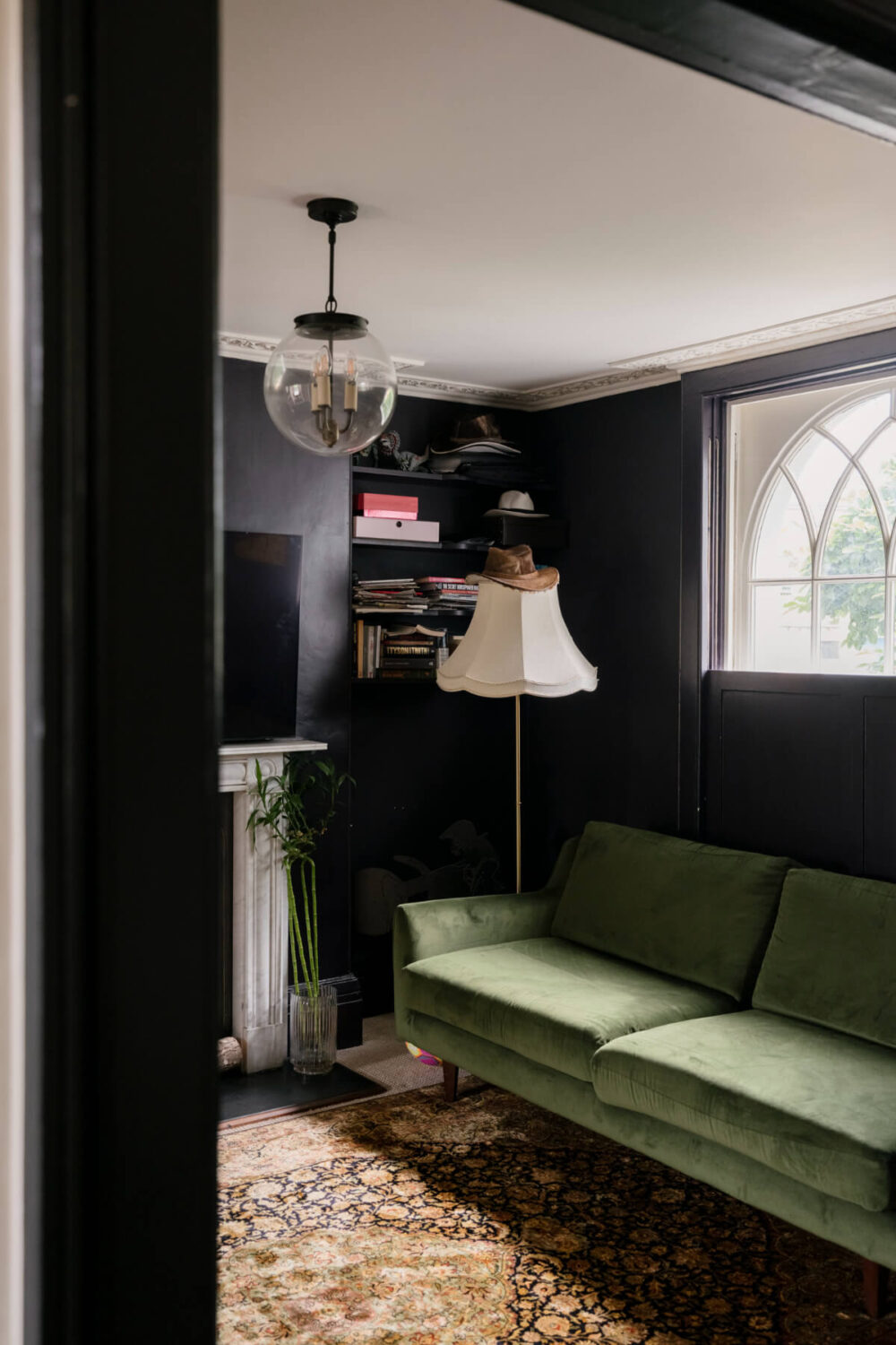 A Classic Georgian House in London with a Lush Garden 5 moody sitting room green sofa