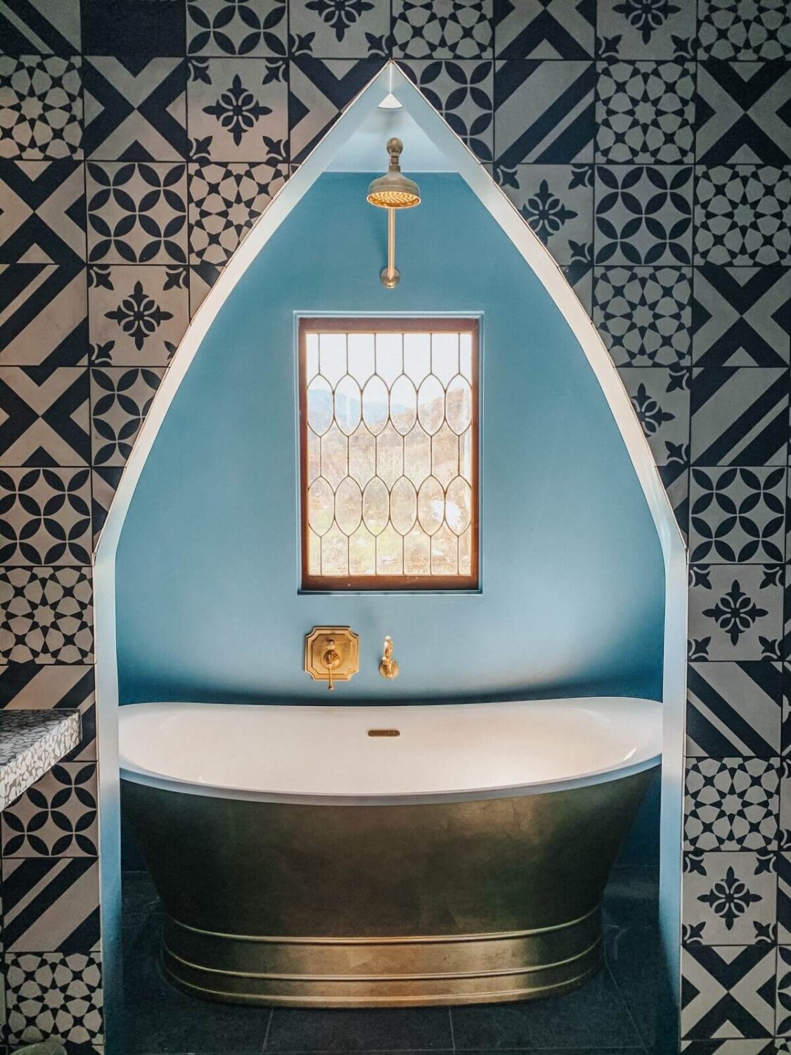 A Colorful Airbnb Home in the Morongo Valley 28 moroccan-style-bathroom-blue-tiles-freestanding-bath-nordroom