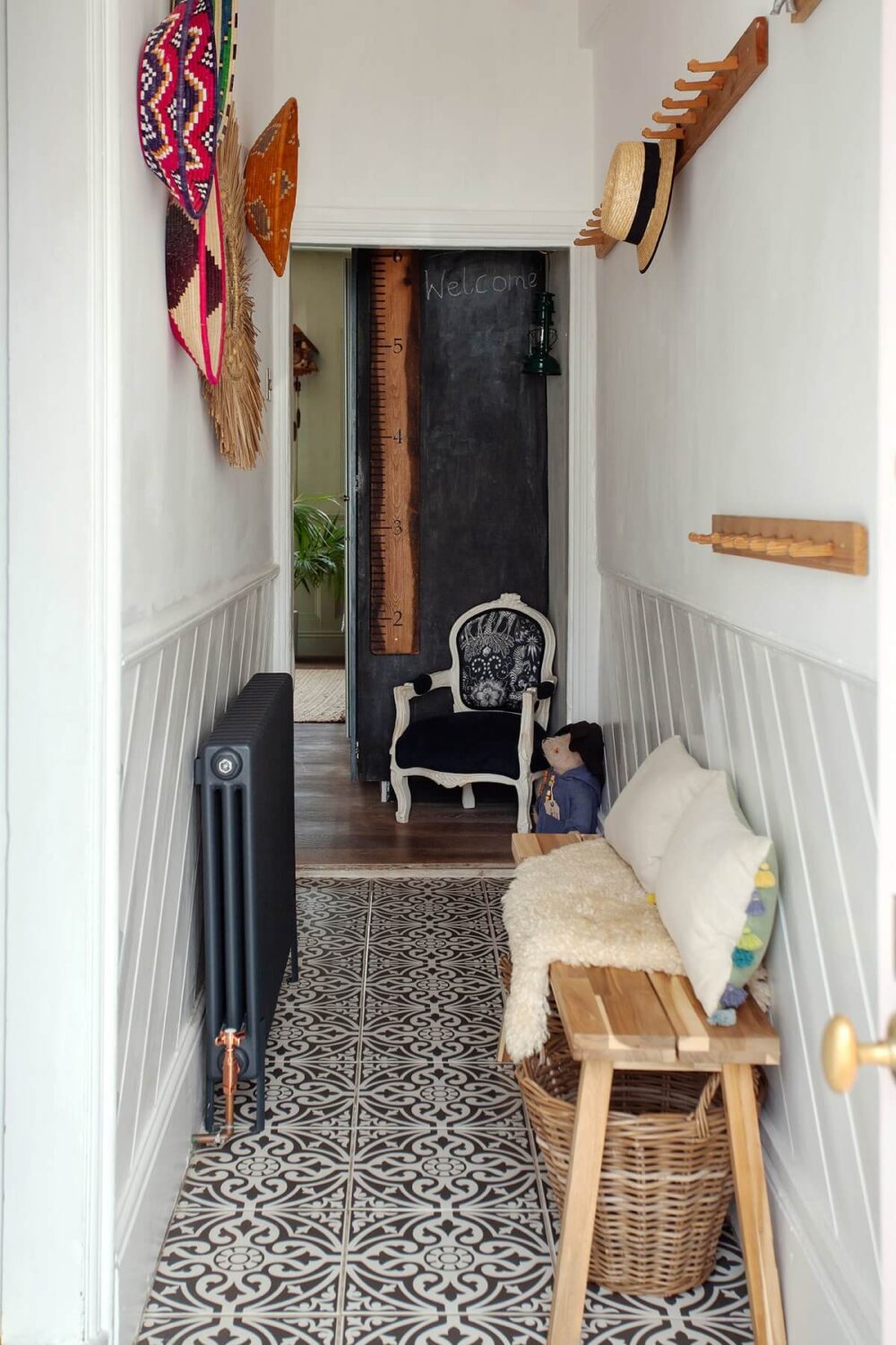Stylish Small Entryway Ideas with Smart Storage Solutions 14 narrow entryway with bench and hooks and black and white floor tiles nordroom