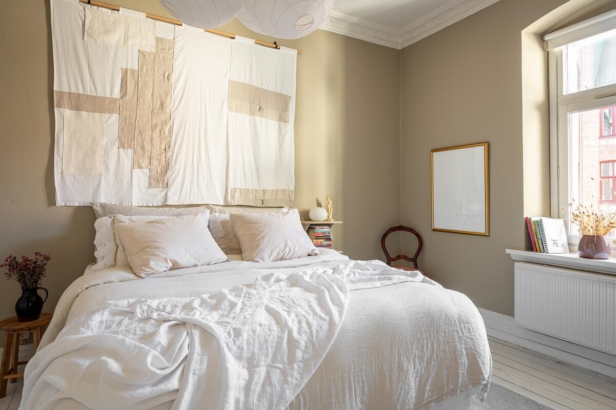 Warm, Neutral Colors in a Lovely Swedish Apartment 13 neutral colored bedroom large tapestry nordroom