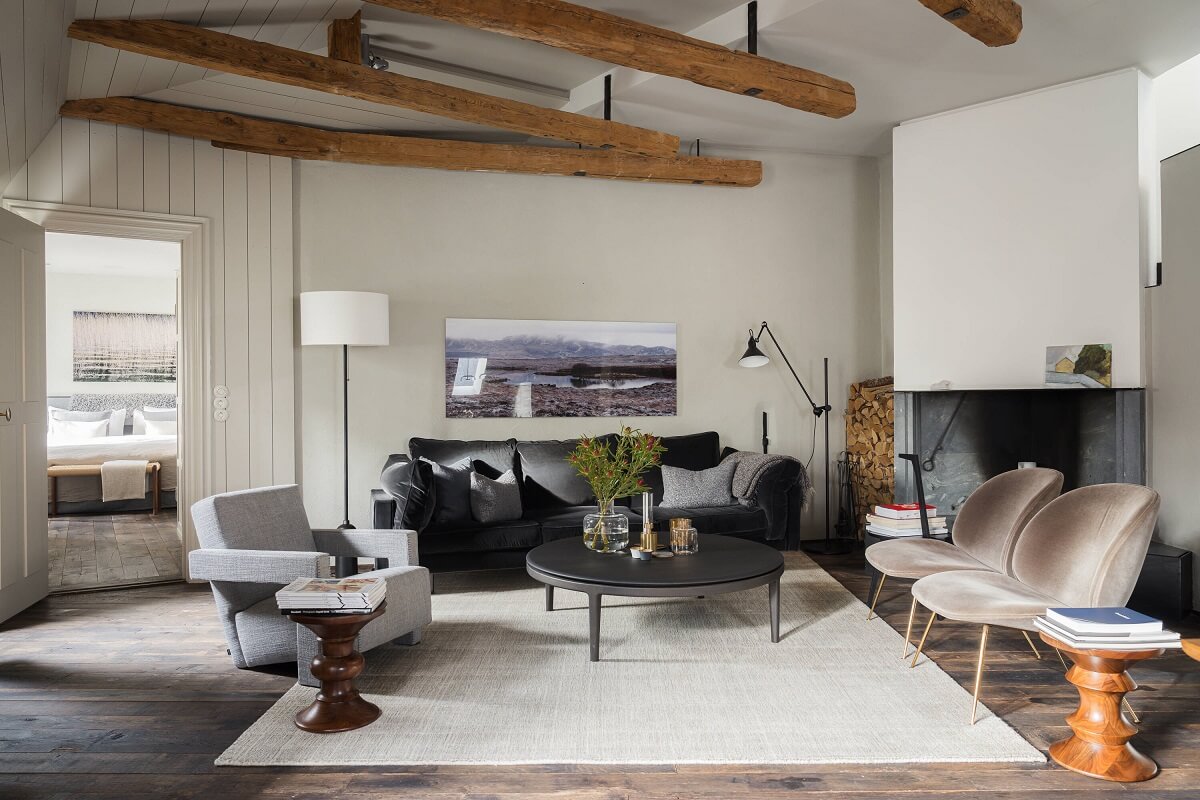 A Stylish Penthouse Apartment with Exposed Beams 7 nordic living room wooden beams penthouse