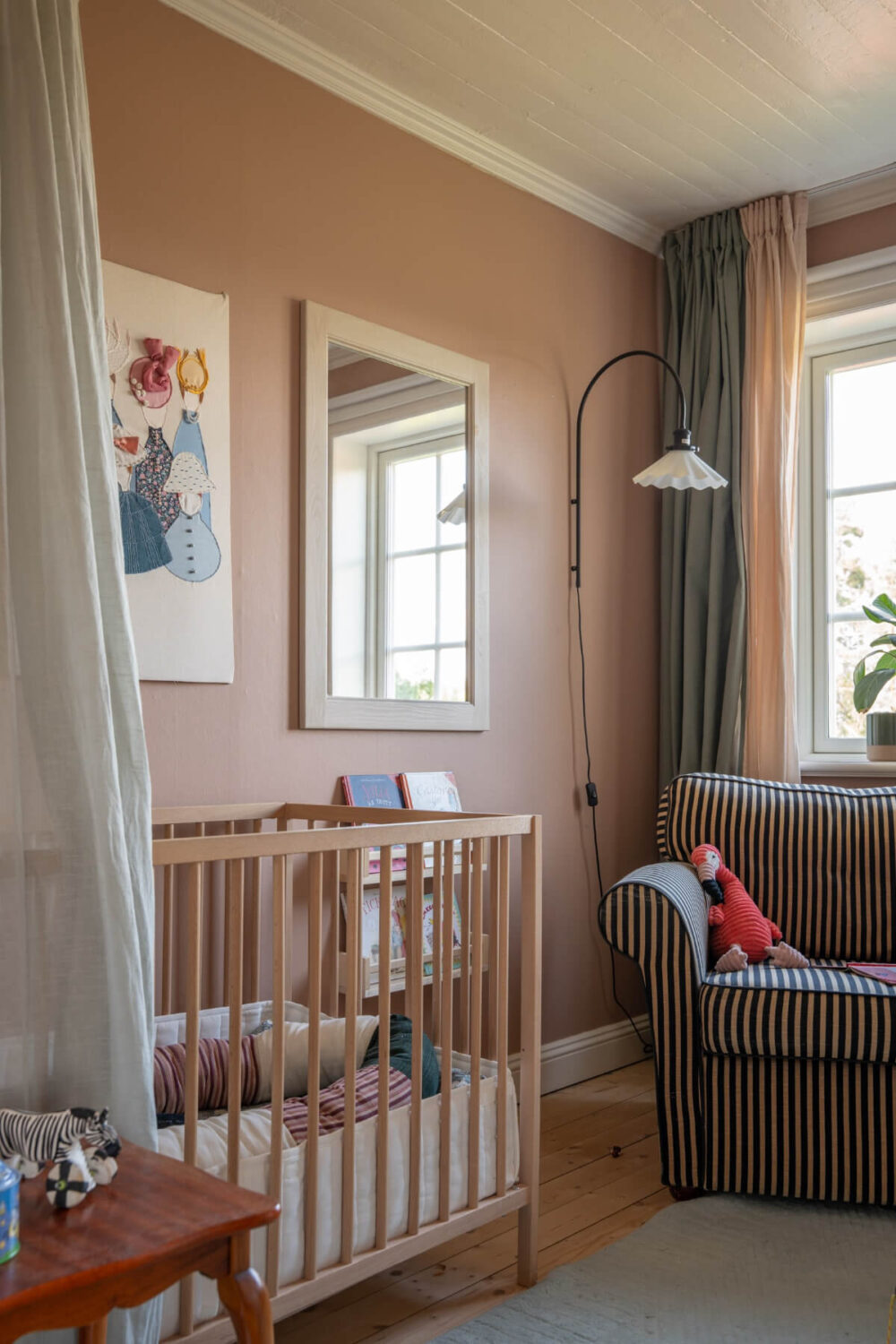 A Charming Historic Country House North of Stockholm 37 nursery with striped chair