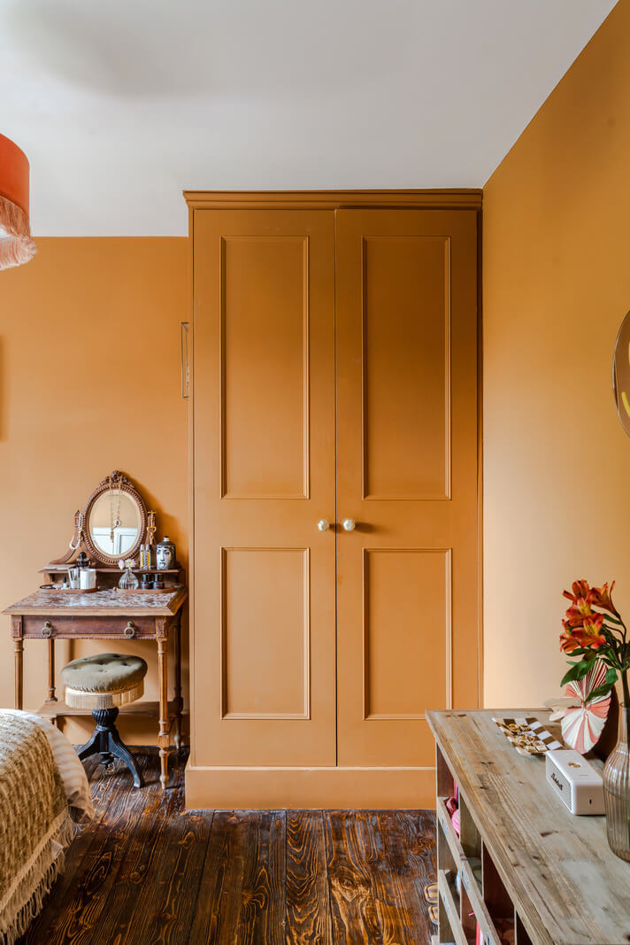 A Victorian Home with a Rich Color Palette and a Beautiful Garden 20 ochre bedroom built-in wardrobes