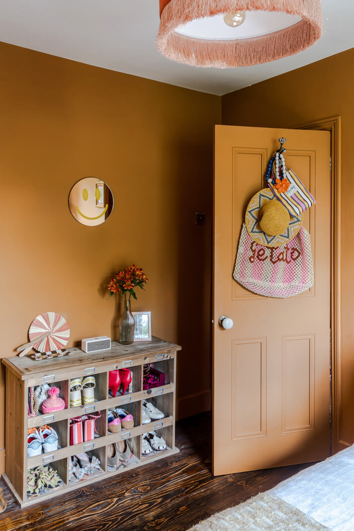 A Victorian Home with a Rich Color Palette and a Beautiful Garden 19 ochre bedroom open shoe cabinet