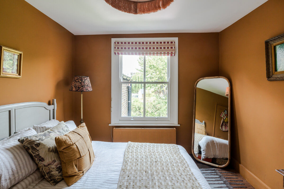 A Victorian Home with a Rich Color Palette and a Beautiful Garden 18 ochre bedroom