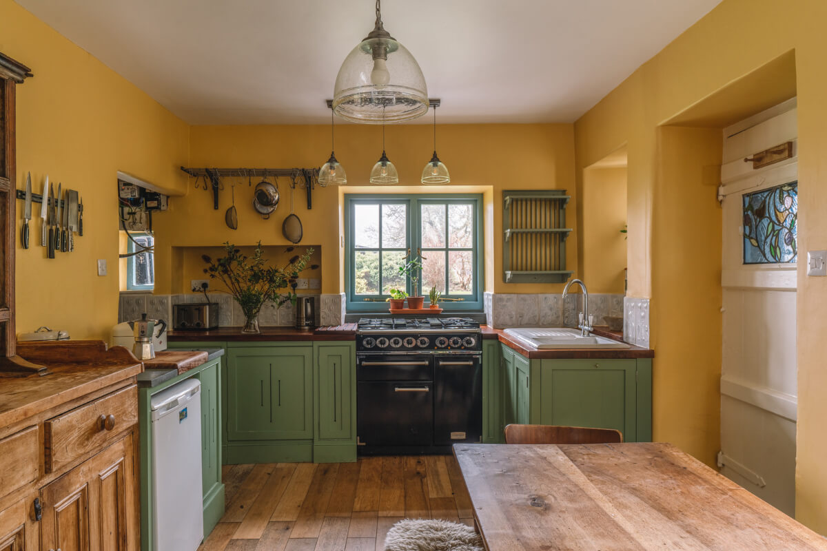 A Colorful 19th-Century Cottage in the Lake District 1 ochre yellow and green kitchen