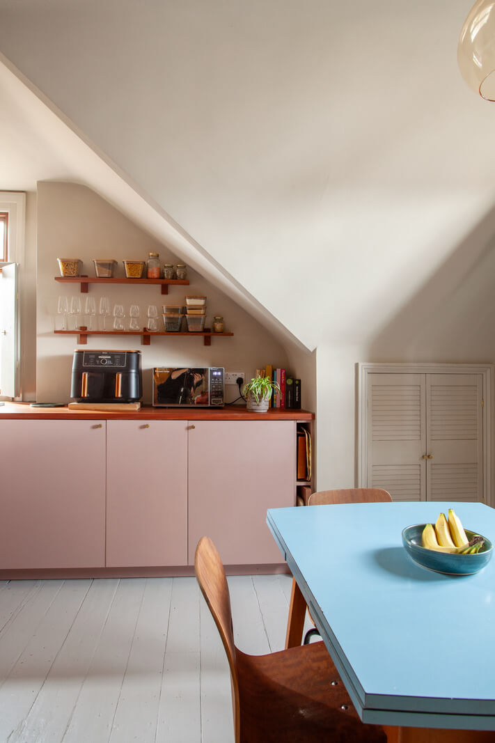 Pastel Tones and Midcentury Design in a Top Floor London Apartment 8 open-plan kitchen space slanted ceilings
