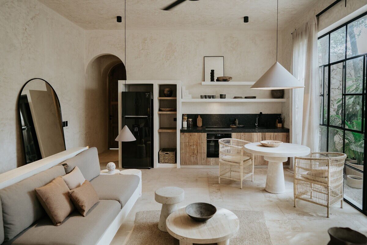 A Serene Design Apartment in Tulum 14 open-plan-living-room-kitchen-round-dining-table-nordroom
