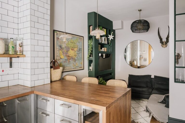 open plan living room kitchen with stainless steel cabients