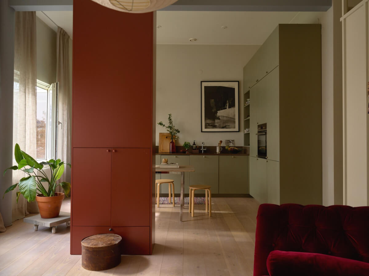 open plan living space with custom cabinet room divider