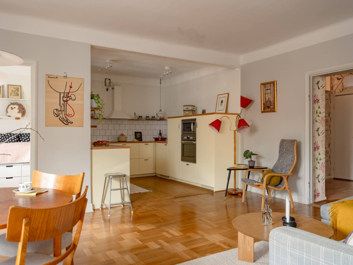 A Light Corner Apartment with a Pale Yellow Kitchen 7 open plan living space yellow kitchen