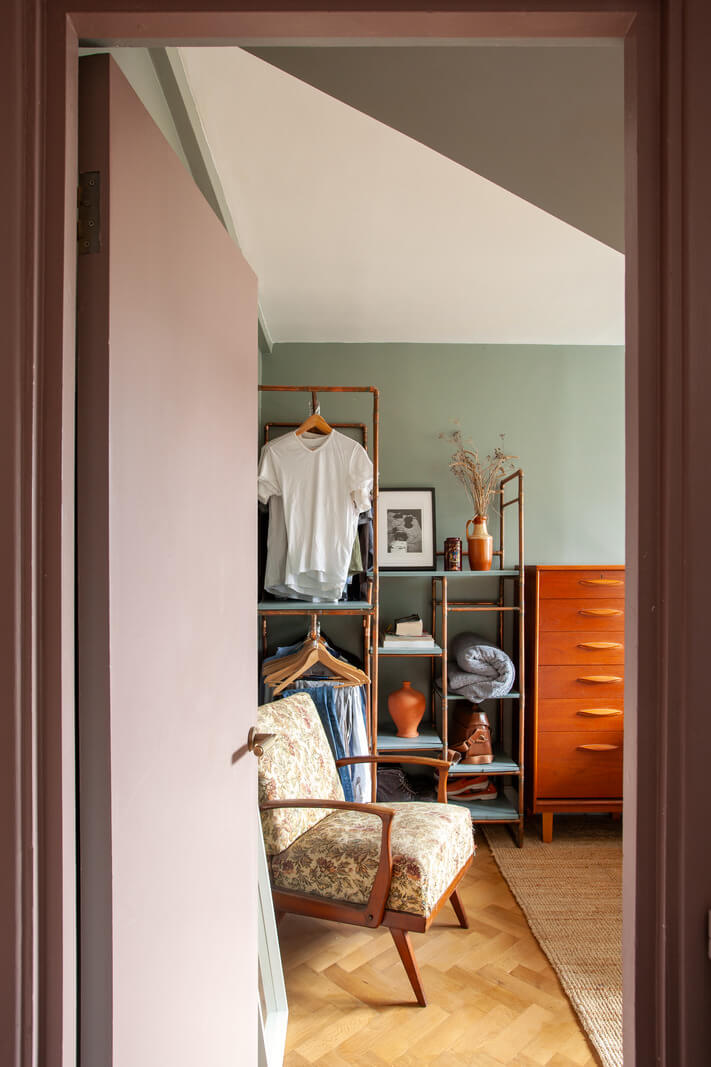Pastel Tones and Midcentury Design in a Top Floor London Apartment 14 open wardrobe storage bedroom