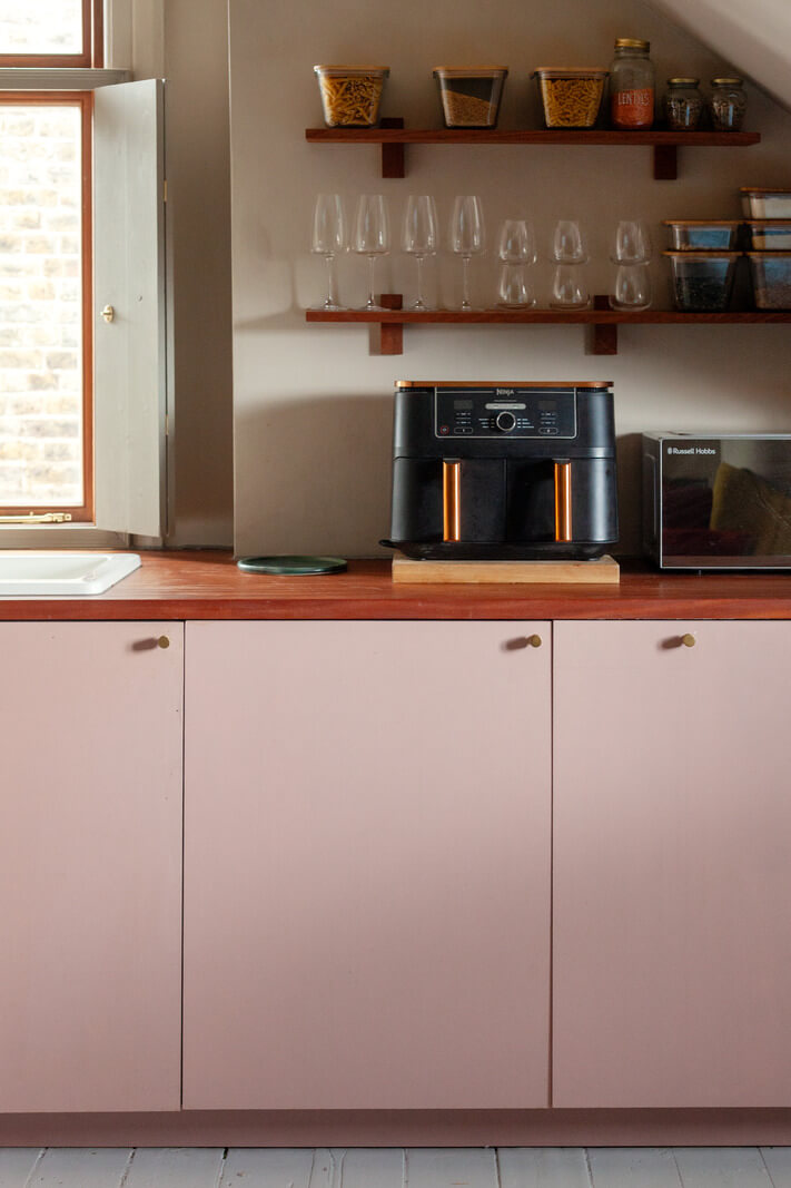 Pastel Tones and Midcentury Design in a Top Floor London Apartment 6 pastel pink kitchen cupboards