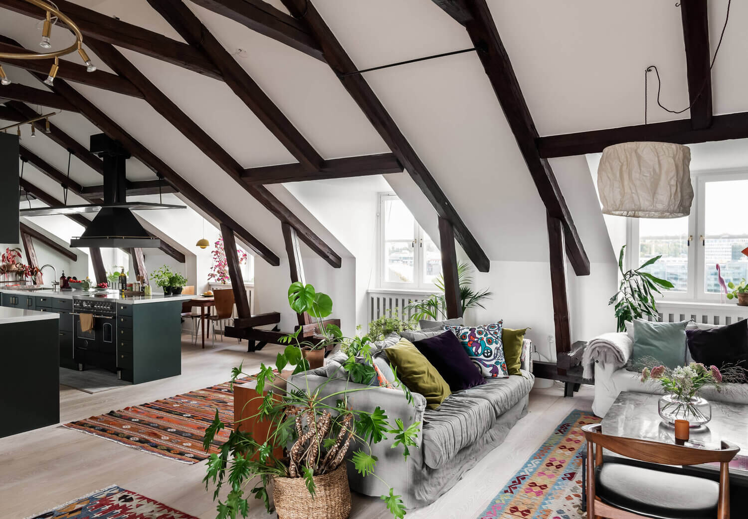 A Scandinavian Penthouse Apartment With A Dark Green Kitchen 1 penthouse dark green kitchen exposed beams the nordroom A Scandinavian Penthouse Apartment With A Dark Green Kitchen