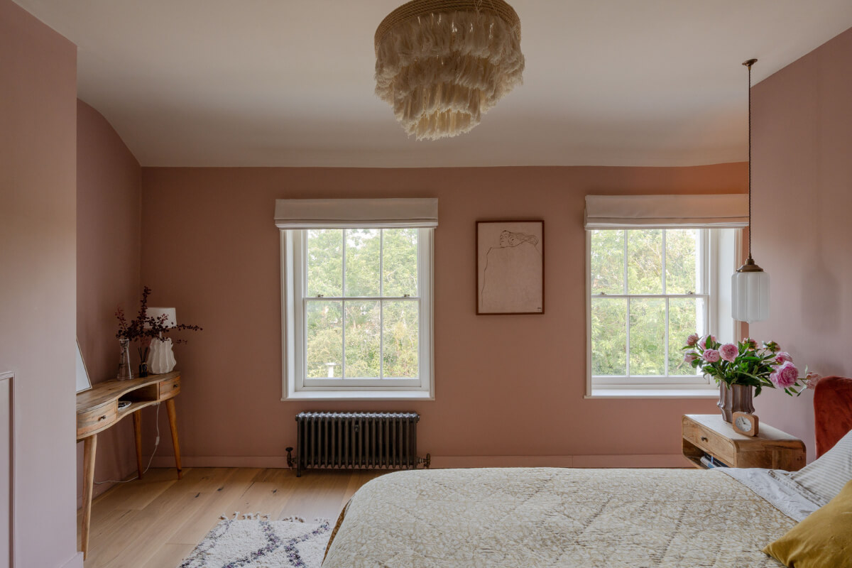Vibrant Colors in a 19th-Century Regency Townhouse in England 22 pink bedroom slanted ceiling