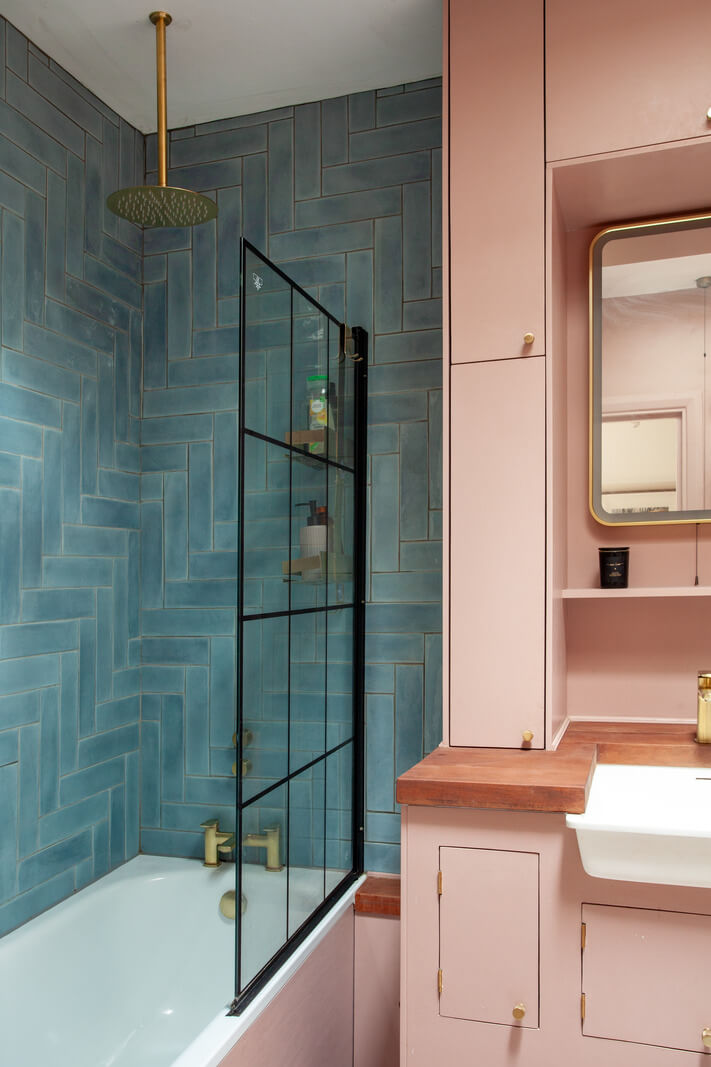 Pastel Tones and Midcentury Design in a Top Floor London Apartment 18 pink cabinets and blue tiles small bathroom
