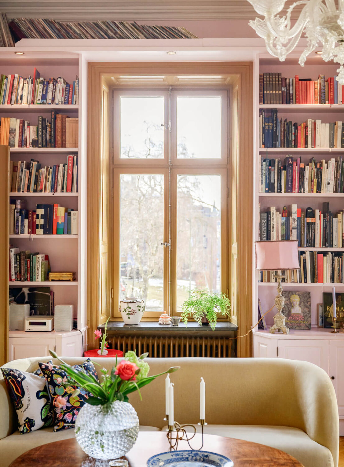 A Pink Living Room in a Light-Filled Stockholm Apartment 2 pink living room bookshelves