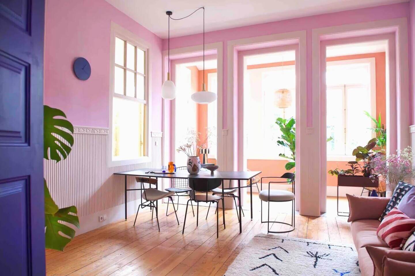A Colorful Airbnb Apartment in Portugal 2 pink living room large windows