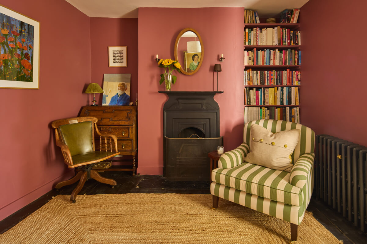 A 19th Century London Cottage with a Stunning Kitchen Extension 4 pink sitting room striped chair built-in shelves fireplace
