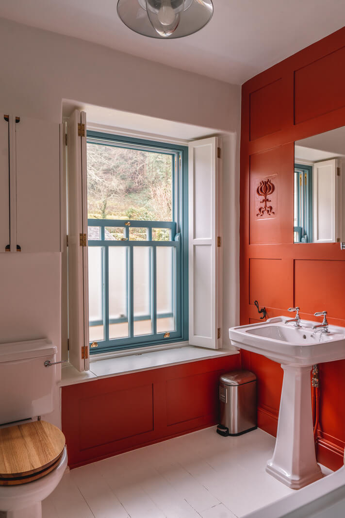 A Colorful 19th-Century Cottage in the Lake District 17 red bathroom white floorboards