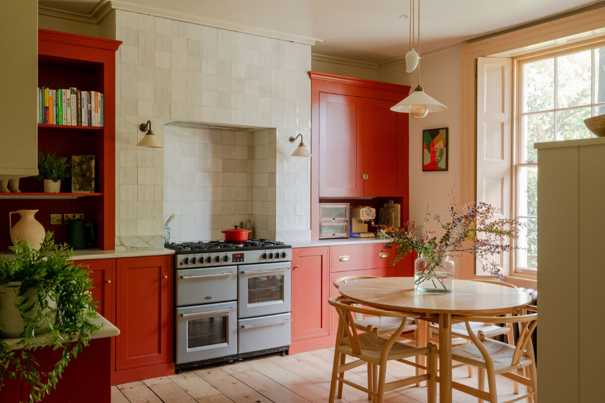Vibrant Colors in a 19th-Century Regency Townhouse in England 1 red kitchen with zellige tiles and round dining table