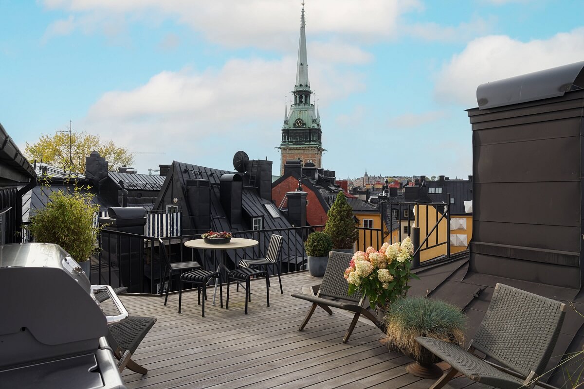 A Stylish Penthouse Apartment with Exposed Beams 30 roof terrace viewof gamla stan