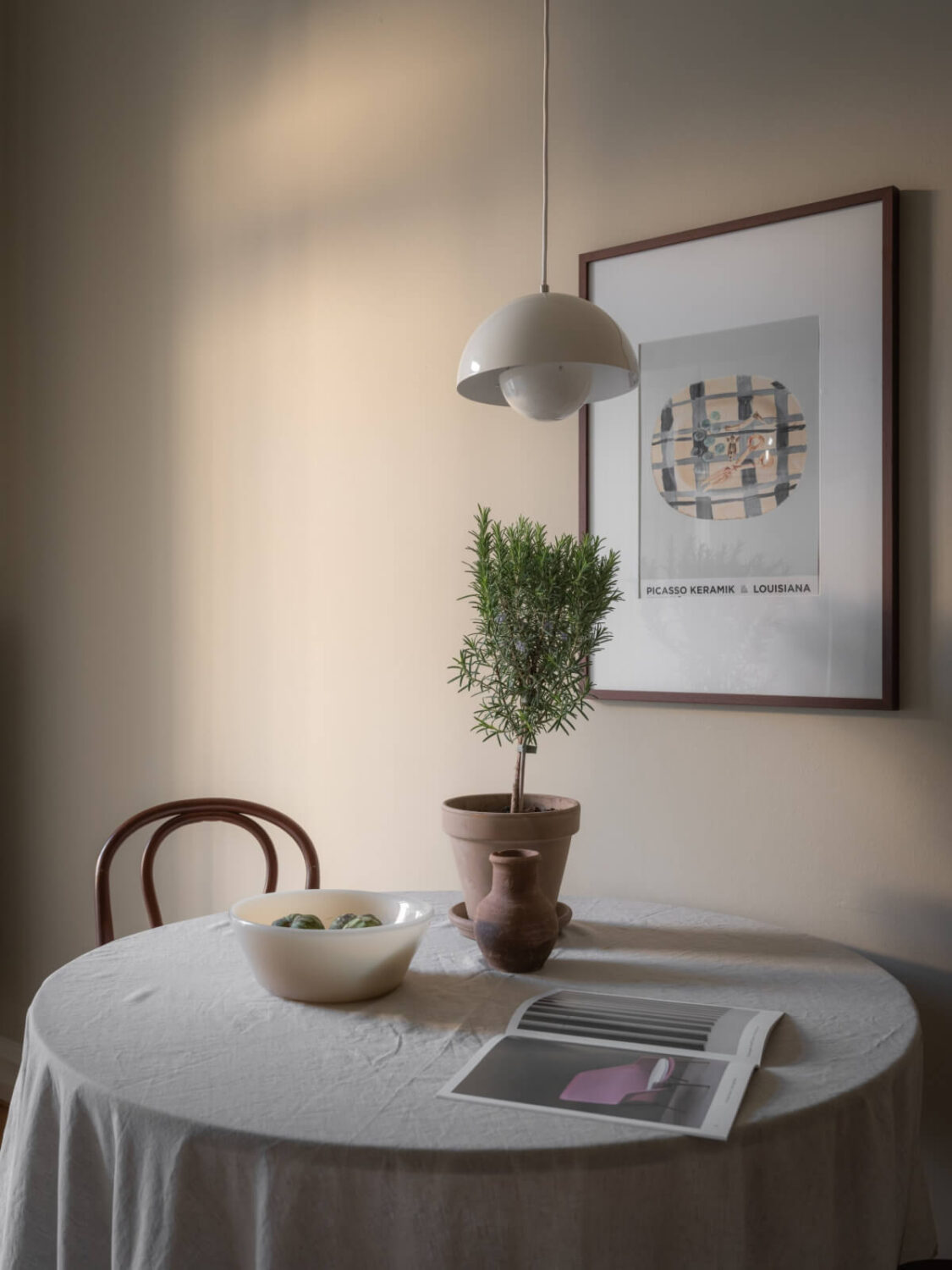 A 19th Century Apartment with a Dark Glass Room Divider 10 round kitchen table